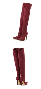 Detail view of burgundy over-the-knee stretch boots with stiletto heels