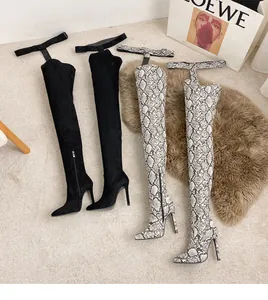Detailed view of sexy pointed-toe over-the-knee boots in black suede and snakeskin print
