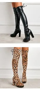 Detailed view of fashionable high-heeled over-the-knee boots in black and leopard print styles