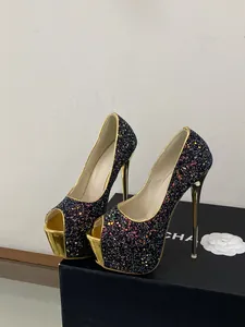 Close-up detail of the glittering sequin surface on black platform peep-toe high heels