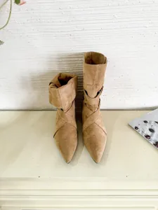 Elegant tan suede pointed-toe slouchy ankle boots featuring stylish low chunky heels