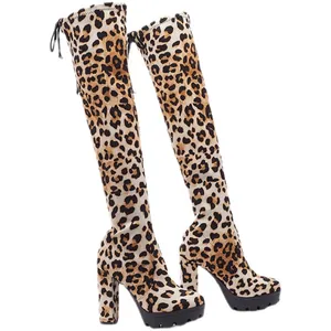 Fashionable leopard print over-the-knee boots featuring high chunky heels and platform soles