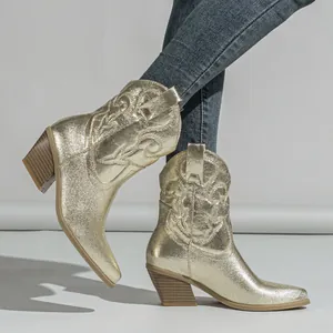 Gold metallic western ankle boots featuring vintage embroidered patterns and chunky heels