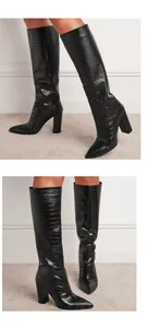 Detail showing black crocodile-embossed knee-high boots with chunky heels and pointed toe
