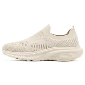 Detailed side view of breathable beige fly-woven slip-on sports sneaker with wide-toe design