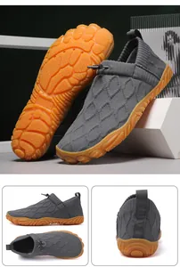 Grey breathable fly-knit outdoor hiking shoes with water-repellent finish and orange sole