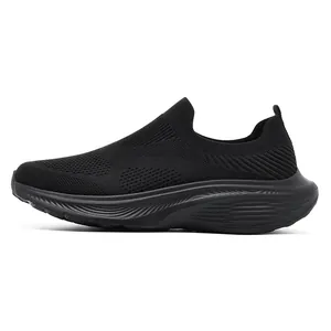 Side view detail of breathable black flyknit slip-on walking shoes with wide toe box.