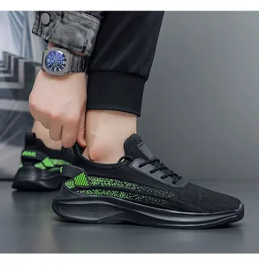 Detailed view of breathable black fly-woven mesh sneaker with neon green accents.