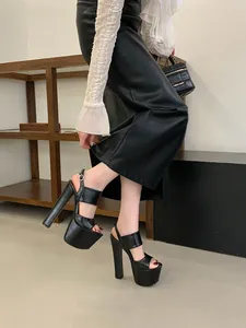 Detail of sexy black high platform sandals featuring a chunky heel and thick waterproof sole