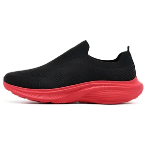 Side profile view of a black and red slip-on breathable fly-knit sneaker for men.