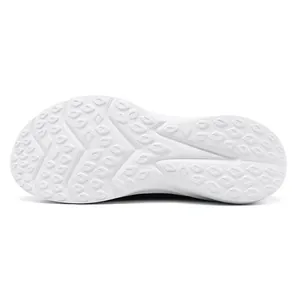 Close-up view of the white anti-slip outsole of men's wide-toe sports sneakers