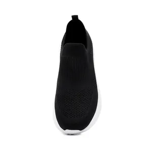 Top down view of men's breathable black fly-knit walking sneakers with a white sole