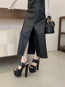 Detailed side view of sexy black chunky high heel sandals with thick platform for stage