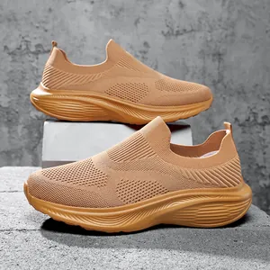 Detailed view of breathable brown textured knit slip-on sneakers for men with wide fit