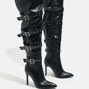 Black pointed-toe thigh-high boots with multiple buckle straps and high stiletto heels