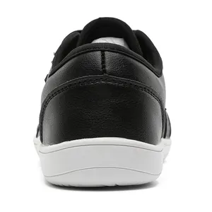 Back view of black leather barefoot shoes with wide toe and white non-slip flat sole