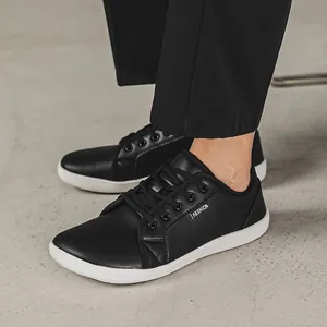 Close-up of black leather barefoot shoes with wide toe box and white sole