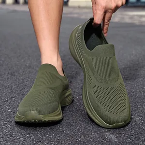Close-up of olive green breathable flying knit slip-on sports shoes for men