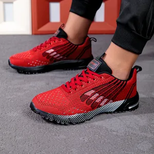 Detailed close-up of red and black mesh running shoes for men with white dotted soles