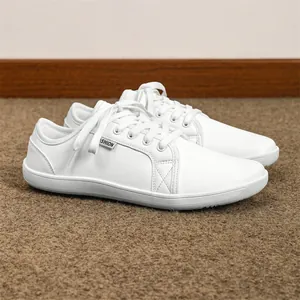 Minimalist white leather barefoot shoes with wide toe box and lace-up casual design