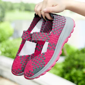 Lightweight pink and grey woven slip-on shoes featuring a breathable elastic hollow-out design