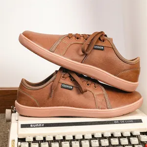 Detailed view of brown leather barefoot shoes with wide toe box and flat anti-slip sole