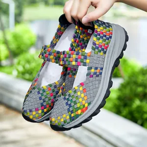 Detail view of colorful elastic woven slip-on shoes with thick soles for breathable casual wear
