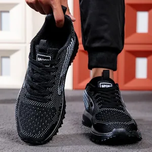 Close-up of black and white breathable knit men's sports running shoes with SPORT logo