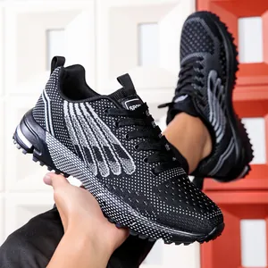 Close-up of lightweight black and white sports sneakers with wing pattern design.