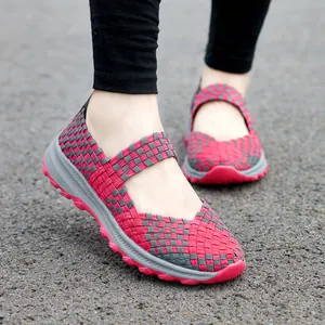 Close-up view of breathable red and grey woven Mary Jane slip-on shoes