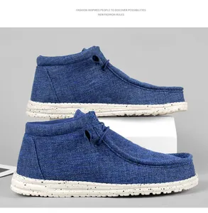Detailed side view of blue canvas high-top loafers with speckled white rubber soles