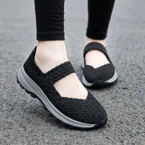 Black woven elastic Mary Jane shoes for women with comfortable thick grey soles outdoors