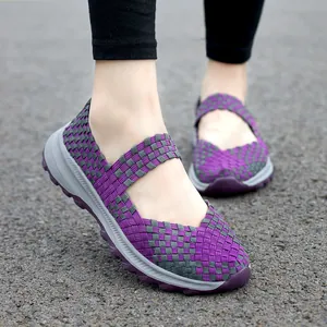Detail view of purple woven elastic Mary Jane shoes with thick cushioned soles for comfort.