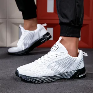 Detailed view of breathable white knit running shoes with stylish grey patterns.