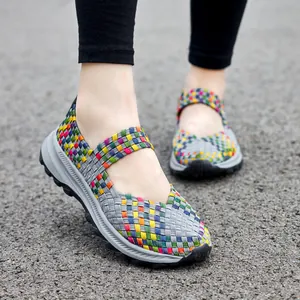 Macro view of multi-colored woven elastic fabric and thick sole on women's casual shoe