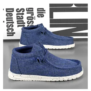 Close-up side view of blue canvas high-top loafers showcasing fabric texture and sole