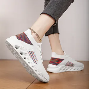 Side view of breathable fly-woven sneakers with rainbow accents and hollow soles.