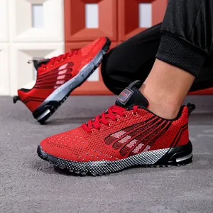 Men's fashionable red mesh running shoes with breathable design for casual sports activities.