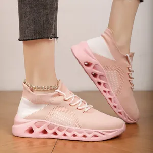 Breathable pink and white fly-knit mesh sports sneakers for casual running and walking.