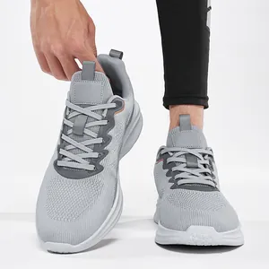 Detailed view of grey breathable fly-knit mesh running sneakers for men in large sizes