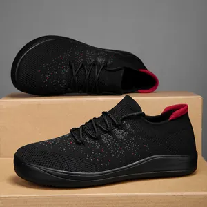 Black fly-knit lightweight men's casual sock sneakers with red speckled details