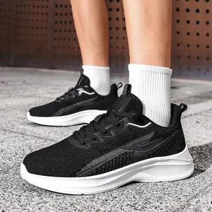Detail view of men's breathable black fly-knit athletic shoes for casual running.