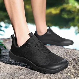Black barefoot outdoor hiking shoes featuring a wide toe box for trail running and trekking