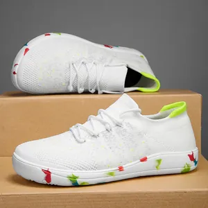 Breathable white men's fly-knit sock shoes featuring a vibrant colorful splatter sole
