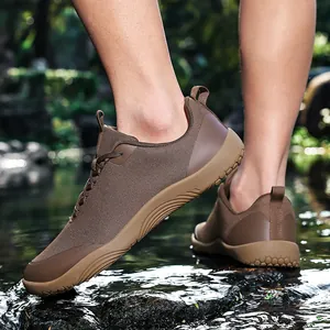 Men's brown wide-toe hiking shoes designed for outdoor trekking on wet river rocks
