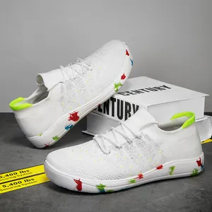 Lightweight white fly-knit men's sneakers with colorful splatter pattern sole