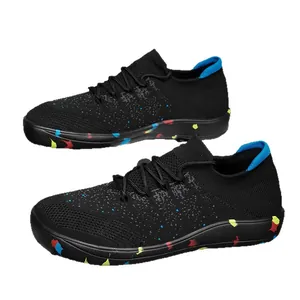 Lightweight black fly-knit sneakers with colorful speckled soles and blue lining accents.