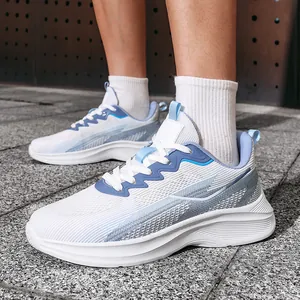Close-up detail of white and blue breathable flyknit mesh running sneakers for men