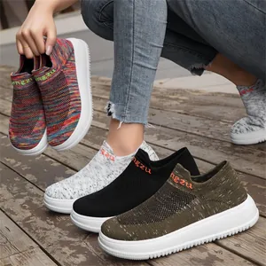 Detailed view of breathable flying woven slip-on sneakers with wide toe and thick white sole