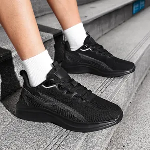 Close-up detail of the breathable black fly-weave mesh on men's athletic running shoes